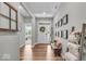 Inviting home foyer featuring stylish decor, hardwood floors, and abundant natural light at 6536 Apperson Dr, Noblesville, IN 46060