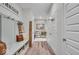 Charming hallway featuring hardwood floors, stylish decor, and ample storage space at 6536 Apperson Dr, Noblesville, IN 46060