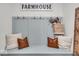 Beautiful hallway featuring a farmhouse sign, coat hooks, and a built-in bench with storage at 6536 Apperson Dr, Noblesville, IN 46060