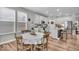 Open concept kitchen with dining area featuring white cabinets and stainless steel appliances at 6536 Apperson Dr, Noblesville, IN 46060