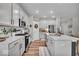 Kitchen featuring white cabinets, stainless steel appliances and large island with seating at 6536 Apperson Dr, Noblesville, IN 46060