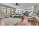 Spacious living room with large windows, hardwood floors and an open floor plan to kitchen at 6536 Apperson Dr, Noblesville, IN 46060