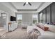 Bright main bedroom offers a tray ceiling, board and batten accent wall, and ample natural light at 6536 Apperson Dr, Noblesville, IN 46060
