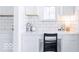 Bright desk area with white backsplash, under-cabinet lighting and classic black chair at 6870 W Buck Stone Dr, McCordsville, IN 46055