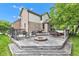 Wooden deck with outdoor seating and a stone fire pit, ideal for gatherings at 705 Ridge Gate Dr, Brownsburg, IN 46112