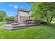 Backyard deck with a fire pit and outdoor seating, perfect for entertaining and relaxation at 705 Ridge Gate Dr, Brownsburg, IN 46112