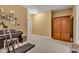 Finished basement area with an armoire, piano, and treadmill for exercise at 705 Ridge Gate Dr, Brownsburg, IN 46112