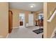 Spacious finished basement with a treadmill, armoire, and access to a bathroom at 705 Ridge Gate Dr, Brownsburg, IN 46112