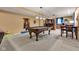 Spacious basement with a pool table, bar area, and dining space at 705 Ridge Gate Dr, Brownsburg, IN 46112