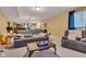 Finished basement with a large sectional, a coffee table, and a bar area at 705 Ridge Gate Dr, Brownsburg, IN 46112
