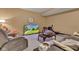 Basement sitting area with a tv displaying the home's exterior at 705 Ridge Gate Dr, Brownsburg, IN 46112