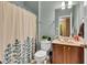 Cozy bathroom with shower-tub combination, light-blue walls, and a vanity with marble countertop at 705 Ridge Gate Dr, Brownsburg, IN 46112