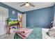 Bedroom with blue walls and doorway showing access to the upstairs area at 705 Ridge Gate Dr, Brownsburg, IN 46112