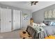 Comfortable bedroom features neutral-toned walls, plush carpeting, and ample natural light at 705 Ridge Gate Dr, Brownsburg, IN 46112