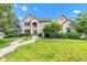 Traditional two-story brick home with a well-manicured lawn and mature trees at 705 Ridge Gate Dr, Brownsburg, IN 46112
