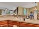 Beautiful kitchen sink and countertop area showcasing an open view into the adjacent living space at 705 Ridge Gate Dr, Brownsburg, IN 46112