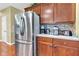 Gourmet kitchen featuring stainless steel appliances, wood cabinetry, and granite countertops for easy meal preparation at 705 Ridge Gate Dr, Brownsburg, IN 46112