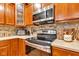 Updated kitchen featuring stainless steel appliances and a stylish backsplash for an enhanced cooking experience at 705 Ridge Gate Dr, Brownsburg, IN 46112