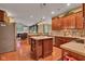 Well-equipped kitchen with a center island, stainless appliances, and views of the adjacent living area at 705 Ridge Gate Dr, Brownsburg, IN 46112