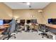 This home office features multiple computer monitors and comfortable chairs for an optimal work environment at 705 Ridge Gate Dr, Brownsburg, IN 46112