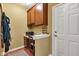 A cozy office nook with built-in desk, wooden cabinets, and a charming decorative shelf near a white door at 705 Ridge Gate Dr, Brownsburg, IN 46112