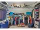Spacious walk-in closet with metal shelving, hanging rods, and ample storage space for clothes and accessories at 705 Ridge Gate Dr, Brownsburg, IN 46112