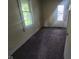 Bedroom featuring brown carpet, an outdated window view and standard closet at 711 W Centennial Ave, Muncie, IN 47303