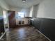 Small kitchen space with lower cabinets, a white sink, and vinyl flooring at 711 W Centennial Ave, Muncie, IN 47303