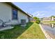 Scenic backyard view features home's AC Unit, pond, and manicured lawn at 7150 Eagle Cove Dr, Indianapolis, IN 46254
