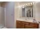 Bathroom features a vanity with mirror, ample lighting, and a shower with glass doors at 7150 Eagle Cove Dr, Indianapolis, IN 46254