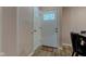 Bright entryway featuring a decorative glass door, wood-look floors, and coat closet at 7150 Eagle Cove Dr, Indianapolis, IN 46254