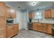 Well-lit kitchen features wood cabinets, stainless appliances, and modern countertops at 7150 Eagle Cove Dr, Indianapolis, IN 46254