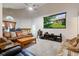 Inviting living room featuring a large movie screen, cozy seating, and an abundance of natural light at 7150 Eagle Cove Dr, Indianapolis, IN 46254