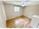 Cozy bedroom featuring hardwood floors and a window at 725 N State Road 75, Lebanon, IN 46052