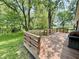 Wooden deck overlooking a private, tree-lined backyard at 725 N State Road 75, Lebanon, IN 46052
