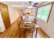 Dining area open to kitchen featuring natural light and wood floors at 725 N State Road 75, Lebanon, IN 46052