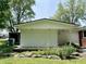 Charming outbuilding with a wooden deck surrounded by landscaped garden at 725 N State Road 75, Lebanon, IN 46052