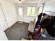 Entryway featuring tile floor, coat rack and window view to the yard at 725 N State Road 75, Lebanon, IN 46052