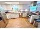 Well-lit kitchen features stainless appliances and ample storage space at 725 N State Road 75, Lebanon, IN 46052