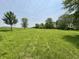 Expansive green field on a sunny day, ready for development or recreation at 725 N State Road 75, Lebanon, IN 46052