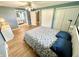 Stylish main bedroom featuring hardwood floors, ceiling fan, and access to an ensuite bathroom at 725 N State Road 75, Lebanon, IN 46052