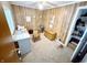 Cozy office space with carpet, wooden desk, storage, and natural light from the window at 725 N State Road 75, Lebanon, IN 46052