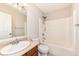 Bathroom featuring shower and bath, toilet, vanity sink, and mirror at 7639 Foxglove Ln, Noblesville, IN 46062