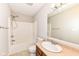 Clean bathroom with standard tub, neutral colors and sink with large mirror at 7639 Foxglove Ln, Noblesville, IN 46062
