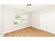 Bedroom featuring wood flooring, a window with blinds, and a closet at 7639 Foxglove Ln, Noblesville, IN 46062