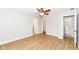 Spacious bedroom features wood-look floors, ceiling fan, and multiple closets at 7639 Foxglove Ln, Noblesville, IN 46062