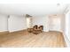 Inviting living room with wood-look flooring, neutral paint, a ceiling fan and white trim, ready for relaxation at 7639 Foxglove Ln, Noblesville, IN 46062