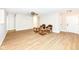 Bright living room with wood-look flooring, neutral walls, ceiling fan and comfortable seating arrangements at 7639 Foxglove Ln, Noblesville, IN 46062