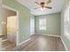 Cozy bedroom featuring hardwood floors, a window, and calming green walls, offering a relaxing atmosphere at 7928 Vontress St, Coatesville, IN 46121