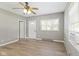 Spacious living room with hardwood floors and neutral tones offering a versatile living space with lots of natural light at 7928 Vontress St, Coatesville, IN 46121